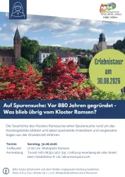 Eine malerische Landschaft mit blühenden Blumen und historischen Gebäuden. Der Himmel ist klar und die Schönheit der Umgebung lädt zu einer Erkundungstour ein.